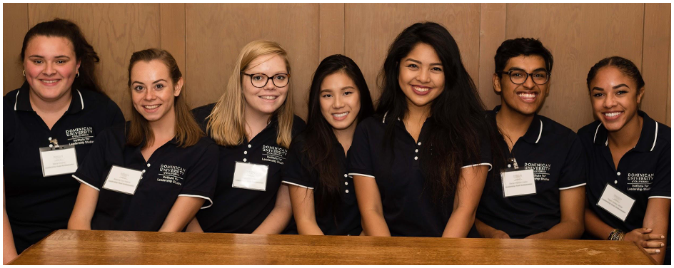 Seven smiling and happy Dominican students.